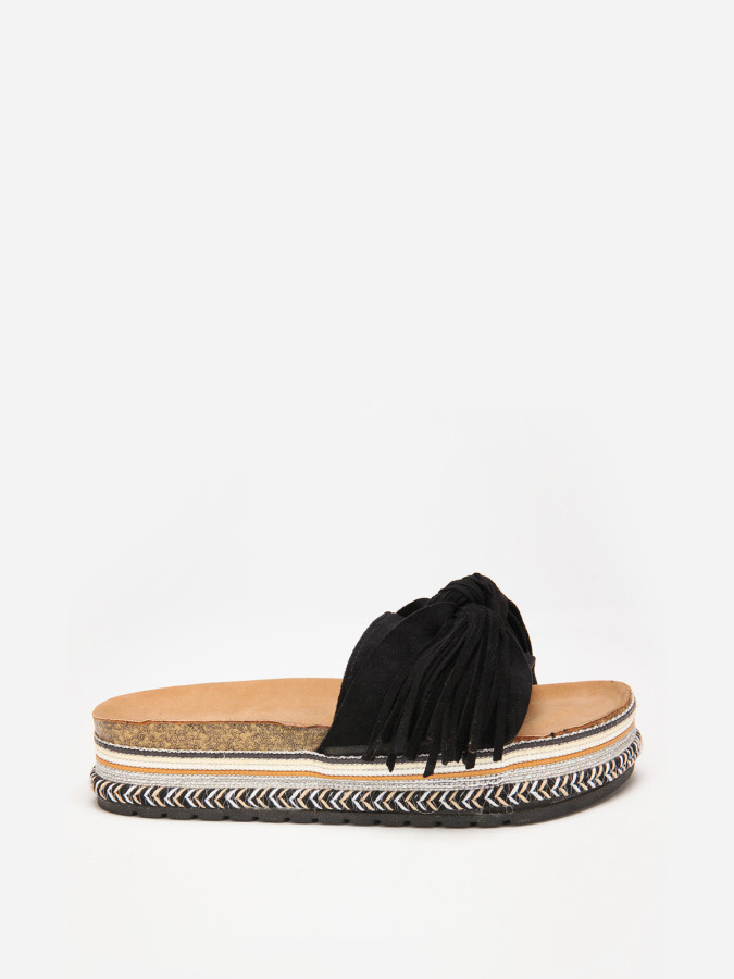 Mules noires à motif ethnique avec noeud et pompon