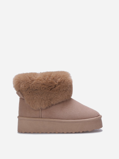 Boots fourrées à plateforme et nœud