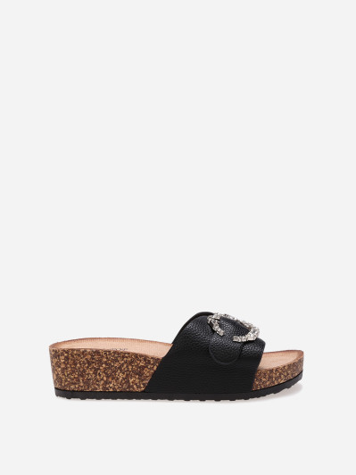 Mules compensées noires avec boucle à strass