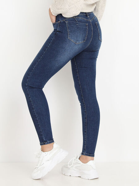 Jeans slim sbiaditi con macchie