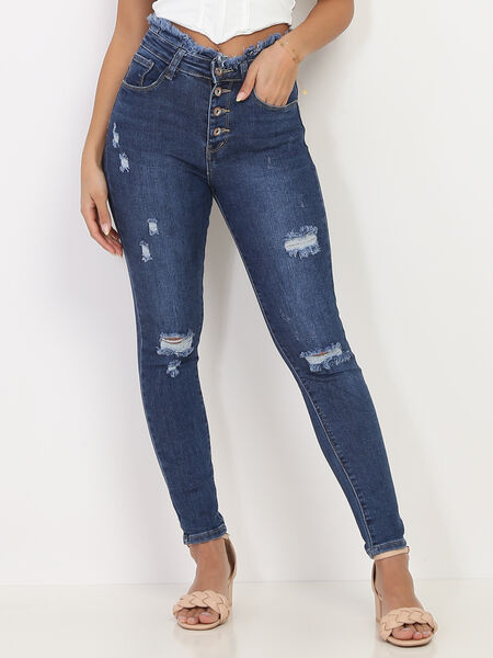 Jeans skinny sfrangiati con buchi